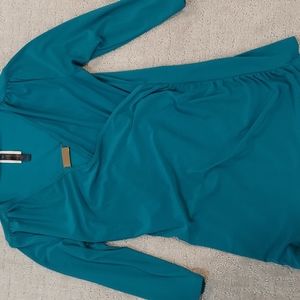 Turquoise top..stretchy material ...easy to wash no iron needed